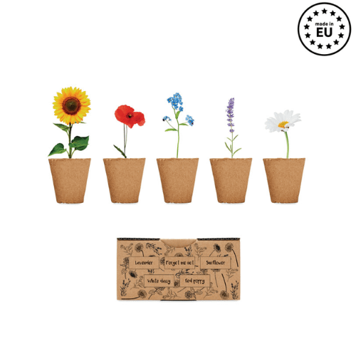 Gadget with logo growing kit FLOWERS Gadget with logo flowers growing kit. Box with lavender, forget me not, sunflower, white daisy and red poppy seeds. Made in EU. Depending on the surface we can use embroidery, engraving, 360° imprint or screen print.