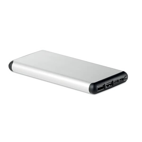 Powerbank with logo wireless SIUR POWER Powerbank with logo with 10000 mAh in aluminium case with suction cups for ease of use whilst travelling. Includes wireless output 2A for quick charging, with power delivery (PD) support to charge the newest laptop MacPro®. Available color: Matt Silver Dimensions: 14,4X6,8X1,5 CM Width: 7 cm Length: 14.5 cm Height: 1.4 cm Volume: 0.575 cdm3 Gross Weight: 0.291 kg Net Weight: 0.248 kg Depending on the surface we can use embroidery, engraving, 360° imprint or screen print.