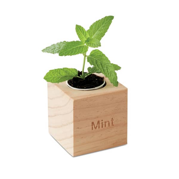 Gadget with logo MENTA Gadget with logo herb pot in wooden case with mint seeds. Depending on the surface we can use embroidery, engraving, 360° imprint or screen print.