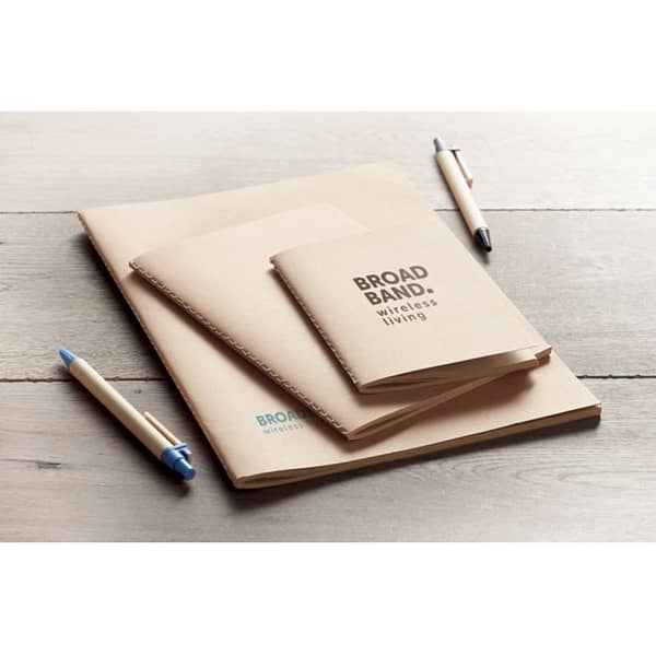 Notebook with logo MINI A6 recycled notebook with logo with carton cover. Sewn. 160 plain recycled paper pages (80 sheets). Depending on the surface we can use embroidery, engraving, 360° imprint or screen print.
