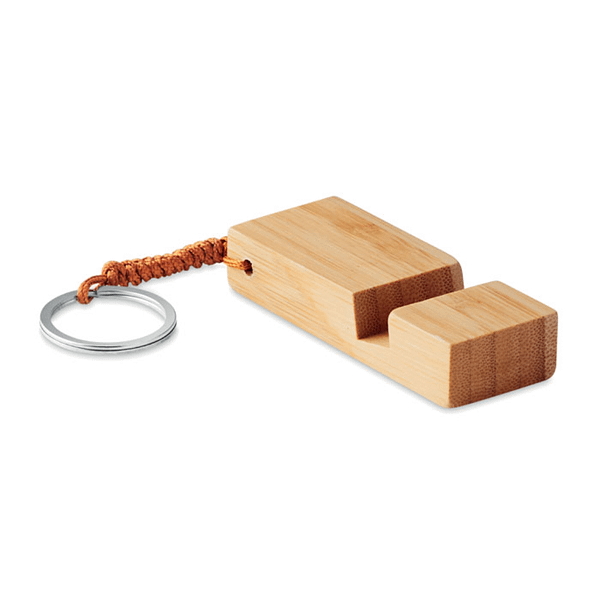 Gadget with logo Key ring TRINEU Key ring with Smartphone stand in bamboo. Bamboo is a natural product, there may be slight variations in colour and size per item, which can affect the final decoration outcome. Available color: Wood Dimensions: 8X3X1.5CM Width: 3 cm Length: 8 cm Height: 1.5 cm Volume: 0.075 cdm3 Gross Weight: 0.031 kg Net Weight: 0.026 kg Magnus Business Gifts is your partner for merchandising, gadgets or unique business gifts since 1967. Certified with Ecovadis gold!