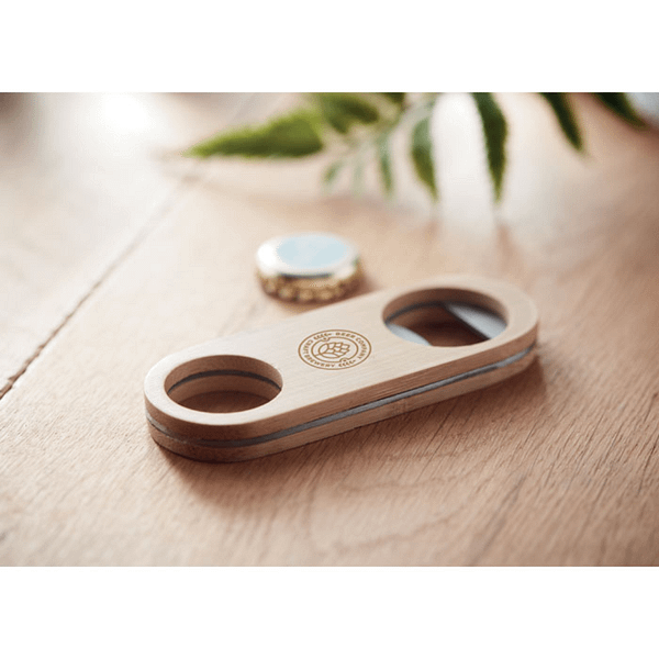 Gadget with logo Bottle opener VALBAMPER Stainless steel speed bottle opener with bamboo surface. Bamboo is a natural product, there may be slight variations in colour and size per item, which can affect the final decoration outcome. Magnus Business Gifts is your partner for merchandising, gadgets or unique business gifts since 1967. Certified with Ecovadis gold!