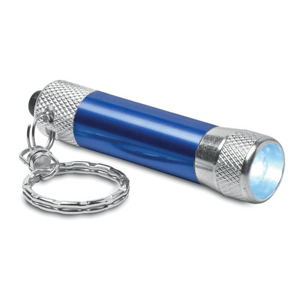Key ring with logo ARIZO Key ring with logo mini aluminium torch with 1 LED key ring. 4 batteries LR44 included.Small and compact to fit on your key ring. Perfect for walking your dog in the evening, and less struggle opening doors in the dark. To see or not to see, that is the question. Available colors: Blue, Black, Red, Silver Dimensions: Ø1,6X6,5 CM Height: 6.5 cm Diameter: 1.6 cm Volume: 0.065 cdm3 Gross Weight: 0.03 kg Net Weight: 0.023 kg Depending on the surface we can use embroidery, engraving, 360° imprint or screen print.