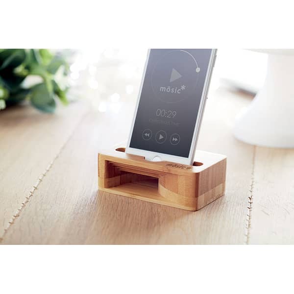 Gadget with logo phone holder bamboo CARACOL Gadget with logo phone holder and amplifier in bamboo material. Available color: Wood Dimensions: 10X6X3,4 CM Width: 6 cm Length: 10 cm Height: 3.4 cm Volume: 0.421 cdm3 Gross Weight: 0.119 kg Net Weight: 0.105 kg Bamboo is a natural product, there may be slight variations in color and size per item, which can affect the final decoration outcome. Depending on the surface we can use embroidery, engraving, 360° imprint or screen print.