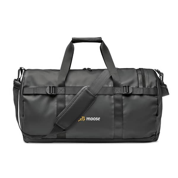 Bag with logo Jaya Duffle Duffle bag, sports or travel bag in 50C tarpaulin with zippered side compartment and zippered inner pocket. With comfort grip handle and padded base. Dimensions: 49X28X28CMWidth: 28 cm Length: 49 cm Height: 28 cm Volume: 7.5 cdm3Gross Weight: 0.75 kg Net Weight: 0.65 kg Available colour black. Magnus Business Gifts is your partner for merchandising, gadgets or unique business gifts since 1967. Certified with Ecovadis gold!