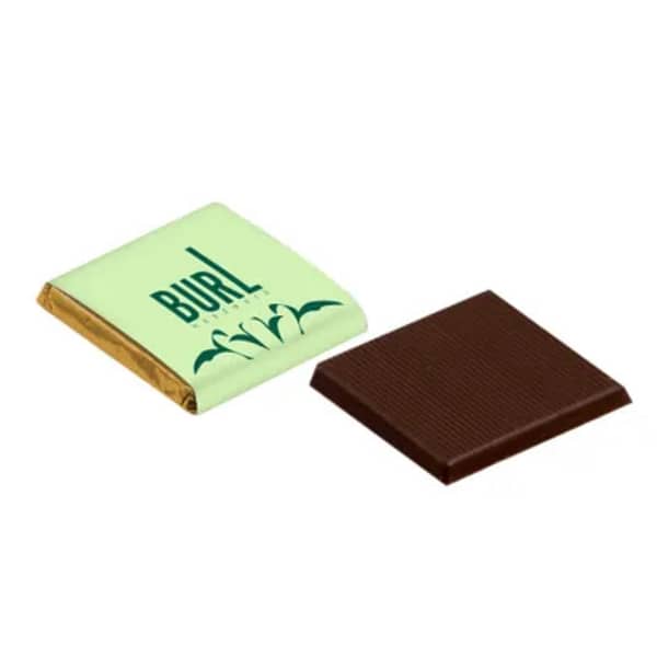 Chocolate with logo Square Napolitain Small but nice! This delicious chocolate comes with a personalized wrapper. Available flavors milk & dark. Delivery time 4 week. Belgium chocolate. Widt 3.50 centimeter - height 0.40 centimeter. 390 per box - box size 39 x 19.50 centimeter. Magnus Business Gifts is your partner for merchandising, gadgets or unique business gifts since 1967. Certified with Ecovadis gold!