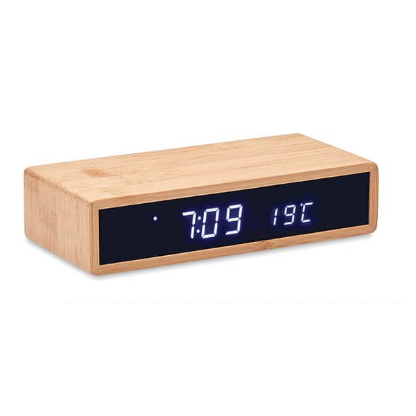Wireless charger with logo alarm clock MORO Wireless charger with logo device including blue LED time display alarm clock and temperature in bamboo casing. AC-DC 2 pin plug adapter included.Wireless output: DC5V/1A (5W). Compatible latest androids, iPhone® 8, X and newer. Not suitable for UK use. Available color: Wood Dimensions: 16X7,5X3,2 CM Width: 7.5 cm Length: 16 cm Height: 3.2 cm Volume: 1.1 cdm3 Gross Weight: 0.317 kg Net Weight: 0.274 kg Depending on the surface we can use embroidery, engraving, 360° imprint or screen print.