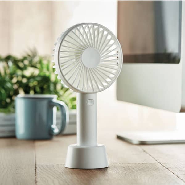 Gadget with logo USB desk fan DINI Gadget with logo small portable fan with additional stand to use as desk fan. 3 speed-settings. USB port rechargeable battery 2000 mA . Depending on the surface we can use embroidery, engraving, 360° imprint or screen print.