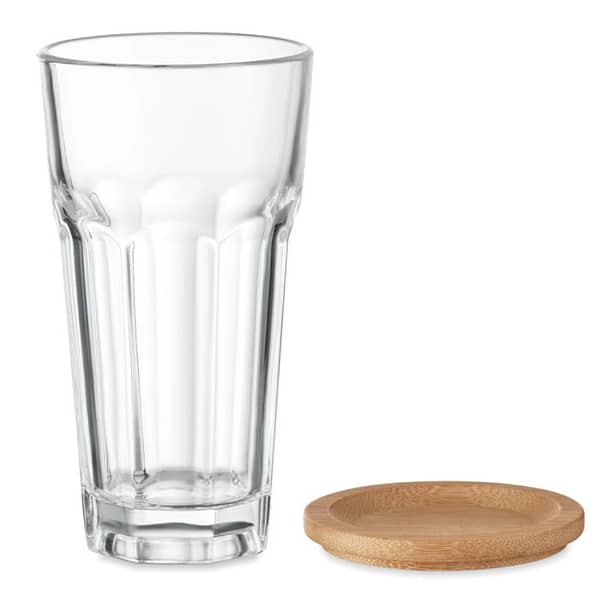Tumbler with logo SEMPRE Re-usable Glass tumbler with bamboo lid that can also be used as coaster. Capacity: 300 ml. Available color: Transparent Dimensions: Ø7,7X14,2 CM Height: 14.2 cm Diameter: 7.7 cm Volume: 1.3 cdm3 Gross Weight: 0.41 kg Net Weight: 0.361 kg Magnus Business Gifts is your partner for merchandising, gadgets or unique business gifts since 1967. Certified with Ecovadis gold!