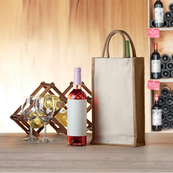 Wine accessoire with logo Tote bag CAMPO DI VINO DUO Wine gift bag for two bottles in jute and 320 gr/mÂ² canvas. Surprise someone special with a pair of delicious wines. Presented in this high quality gift bag, your gift wil definitely be appreciated. Wine bottles are not included. Available color: Beige Dimensions: 20X10X35CM Width: 10 cm Length: 20 cm Height: 35 cm Volume: 1.78 cdm3 Gross Weight: 0.24 kg Net Weight: 0.16 kg Magnus Business Gifts is your partner for merchandising, gadgets or unique business gifts since 1967. Certified with Ecovadis gold!