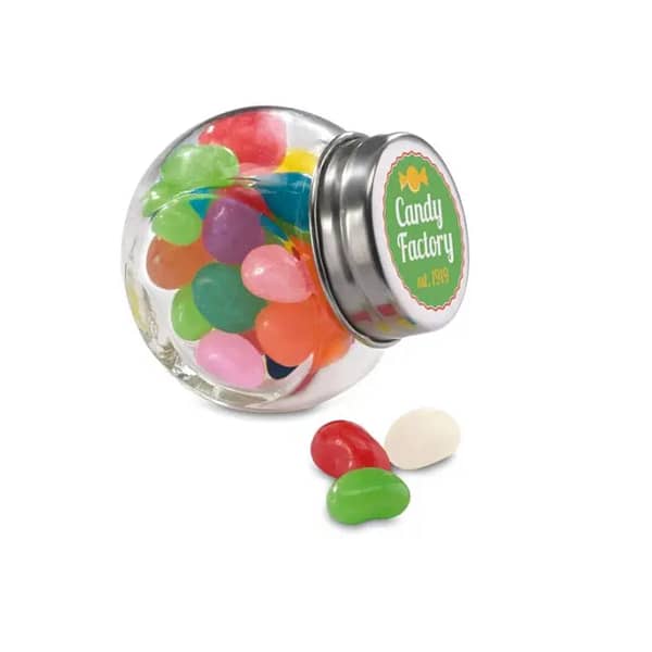 Sweets with logo Jelly Beans BEANDY Multicolour jelly beans in a glass container jar with metallic cover. 30 grams candy. Dimensions: 5.5 x 5 x 3.5 cm Available color: Transparent. Material: Glass Magnus Business Gifts is your partner for merchandising, gadgets or unique business gifts since 1967. Certified with Ecovadis gold!