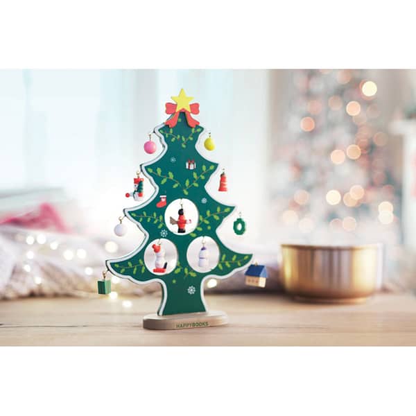 Christmas gadget with logo Hanger WOODTREE Wooden Christmas tree with 12 assorted tree hanger decorations to be assembled. Individual gift box with transparent cover. Available color: Green Dimensions: 22X16,5X2 CM Width: 16.5 cm Length: 22 cm Height: 2 cm Volume: 0.79 cdm3 Gross Weight: 0.116 kg Net Weight: 0.069 kg Magnus Business Gifts is your partner for merchandising, gadgets or unique business gifts since 1967. Certified with Ecovadis gold!