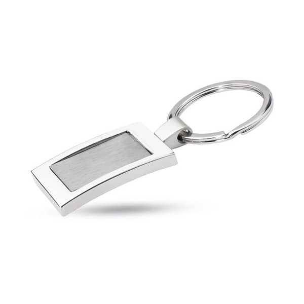 Gadget with logo Key ring HARROBS Metal rectangular key ring with logo. Individually packed in a gift box. Available color: Shiny Silver Dimensions: 8X3,5X0,5 CM Width: 3.5 cm Length: 8 cm Height: 0.5 cm Volume: 0.11 cdm3 Gross Weight: 0.039 kg Net Weight: 0.03 kg Magnus Business Gifts is your partner for merchandising, gadgets or unique business gifts since 1967. Certified with Ecovadis gold!