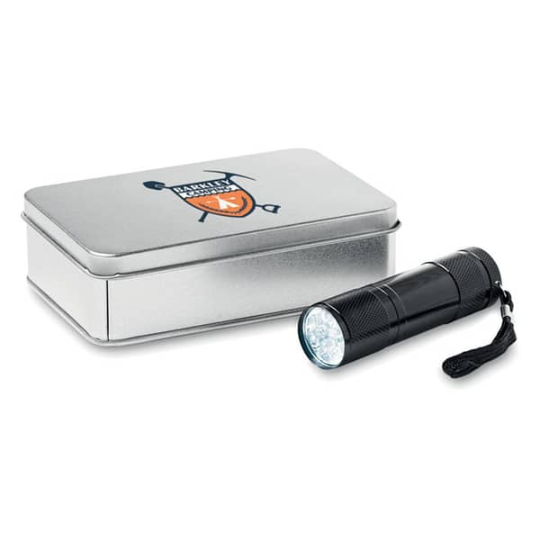 Gadget with logo Torch LED PLUS 9 LED aluminium torch with logo. Delivered with 3xAAA batteries and a detachable strap. Presented in tin box. Available color: Black Dimensions: Ã˜2,5X8,5 CM Height: 8.5 cm Diameter: 2.5 cm Volume: 0.8 cdm3 Gross Weight: 0.197 kg Net Weight: 0.152 kg Magnus Business Gifts is your partner for merchandising, gadgets or unique business gifts since 1967. Certified with Ecovadis gold!