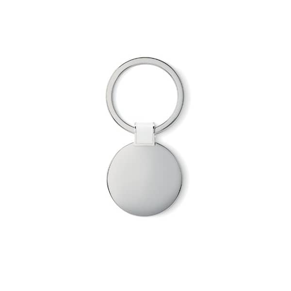 Gadget with logo Key ring Roundy Round shaped metal key ring with logo, shiny nickel finish. Available color: Black, White Dimensions: Ø3,3X0,2 CM Height: 0.2 cm Diameter: 3.3 cm Volume: 0.143 cdm3 Gross Weight: 0.026 kg Net Weight: 0.018 kg Magnus Business Gifts is your partner for merchandising, gadgets or unique business gifts since 1967. Certified with Ecovadis gold!