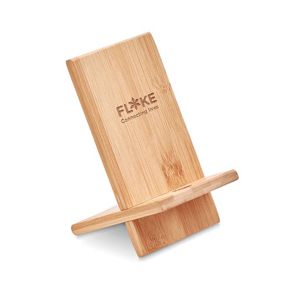 Gadget with logo Phone holder WHIPPY Gadget with logo, phone holder in bamboo. It includes 2 parts, you can assemble it vertically to hold your phone. Bamboo is a natural product, there may be slight variations in color and size per item, which can affect the final decoration outcome. Available color: Wood Dimensions: 14X8X0,7CM Width: 8 cm Length: 14 cm Height: 0.7 cm Volume: 0.294 cdm3 Gross Weight: 0.1 kg Net Weight: 0.084 kg Depending on the surface we can use embroidery, engraving, 360° imprint or screen print.