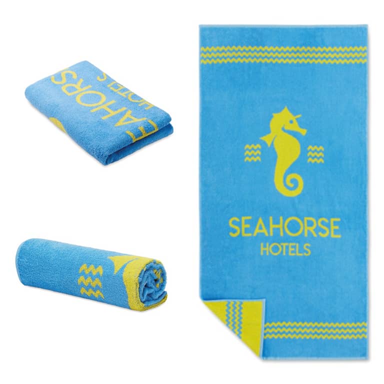 Beach gadget with logo Towel MT4006 Beach gadget with logo yarn dyed jacquard towels are made by weaving 2 colored yarns (100% cotton) to create a bespoke design. The backside of the towel looks like a negative of the front side. Depending on the surface we can use embroidery, engraving, 360Â° imprint or screen print.