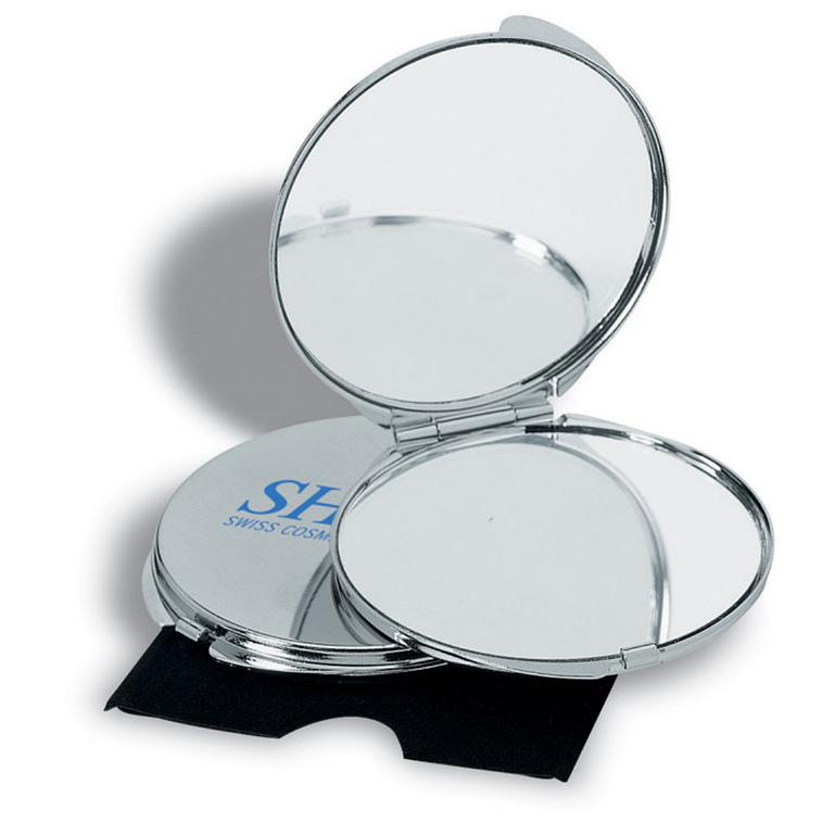 Gadget with logo Mirror GUAPAS Chrome plated metal make up mirror  with logo with regular and magnifying mirrorsin velvet case. Available color: Shiny Silver Dimensions: Ø6X0,5 CM Height: 0.5 cm Diameter: 6 cm Volume: 0.108 cdm3 Gross Weight: 0.053 kg Net Weight: 0.045 kg Magnus Business Gifts is your partner for merchandising, gadgets or unique business gifts since 1967. Certified with Ecovadis gold!