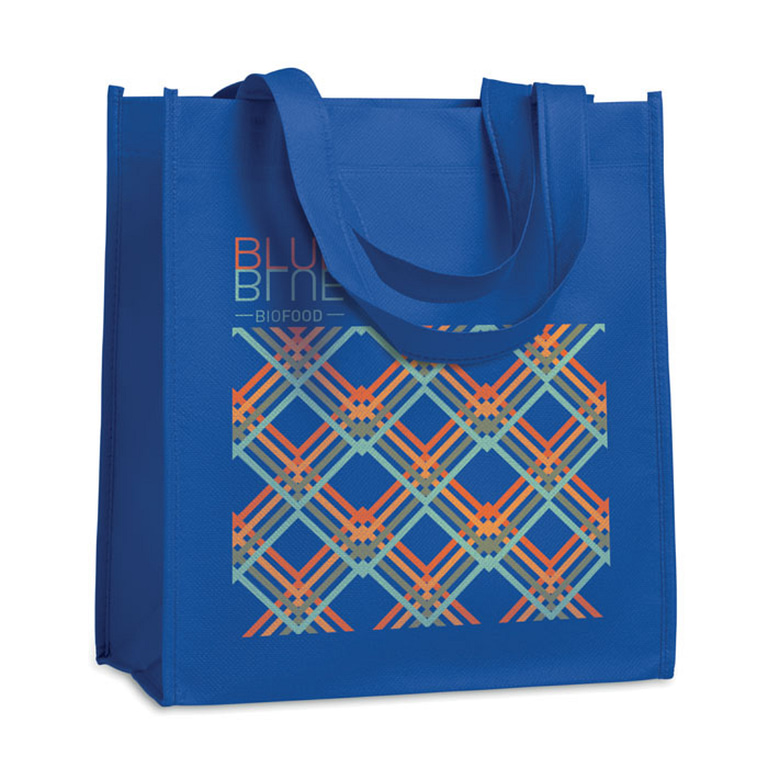 Gadget with logo Totebag APO BAG Nonwoven heat sealed shopping bag with short handles. 80 gr/m². Available color: Royal Blue, White, Black Dimensions: 27X15X30CM Width: 15 cm Length: 27 cm Height: 30 cm Volume: 0.351 cdm3 Gross Weight: 0.038 kg Net Weight: 0.034 kg Magnus Business Gifts is your partner for merchandising, gadgets or unique business gifts since 1967. Certified with Ecovadis gold!