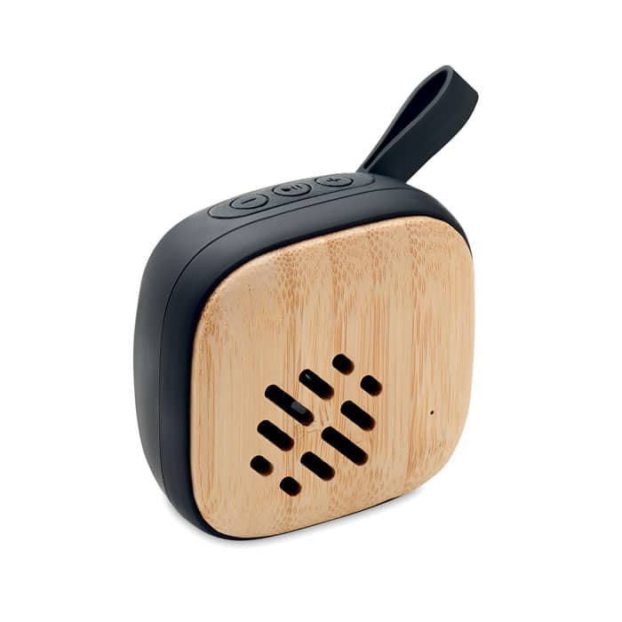 Audio gadget with logo Bluetooth speaker MALA Audio gadget with logo, Bluetooth speaker 5.0 in Bamboo front, ABS back with silicone strap handle. 1 Rechargeable Li-Ion 400 mAh battery. Output data: 3W, 4 Ohm. Playing time approx. 2h. Available color: Black Dimensions: 7X7X3,7 CM Width: 7 cm Length: 7 cm Height: 3.7 cm Volume: 0.36 cdm3 Gross Weight: 0.129 kg Net Weight: 0.105 kg Depending on the surface we can use embroidery, engraving, 360Â° imprint or screen print.