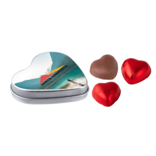 Chocolate with logo in heart shaped tin Give someone a heart under the belt with this heartwarming can. Tin in the shape of a heart filled with 3 chocolate hearts. The original tin is nice to give or receive as a gift for any occasion. Have it printed with your company name or logo. Hand it out to relations you care about and promote your company with this printed giveaway. The can is fun to store and refill. Available color: White, Silver, Red. Magnus Business Gifts is your partner for merchandising, gadgets or unique business gifts since 1967. Certified with Ecovadis gold!