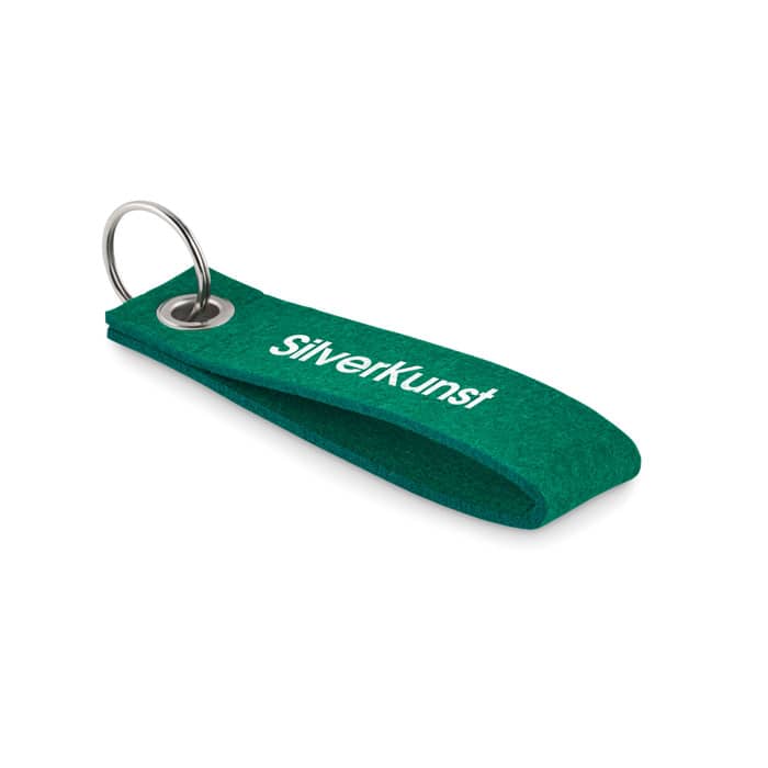 Key ring with logo SUORA Key ring with logo in rectangular RPET felt. Made from a sustainable material. Available colors: Green, Black, Dark Grey, Royal Blue Dimensions: 14X3X0,3CM Width: 3 cm Length: 14 cm Height: 0.3 cm Volume: 0.084 cdm3 Gross Weight: 0.009 kg Net Weight: 0.007 kg Depending on the surface we can use embroidery, engraving, 360° imprint or screen print.