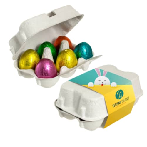 Chocolate with logo Easter eggs If you are looking for the a nicer Easter gift, this egg carton with a personalized wrapper and filled with 6 delicious crispy Easter eggs is the ideal gift! 6 crispy chocolate eggs in assorted colors. This nice box with Easter eggs is the perfect gift. Have the box printed with your own logo and/or text for a personal gift that everyone will be happy with. Available color: Light Grey Magnus Business Gifts is your partner for merchandising, gadgets or unique business gifts since 1967. Certified with Ecovadis gold!